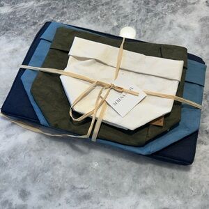 New and never used Uashmama Set of 4 Paper Storage Pouches